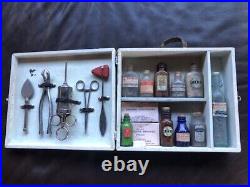 Rare Vintage medical kit in wooden box with bottles and instruments glued