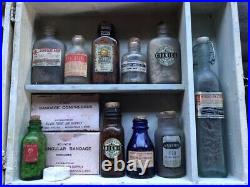 Rare Vintage medical kit in wooden box with bottles and instruments glued