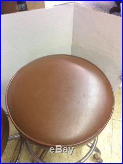 Set of 2 vintage medical stools. 1970's. Brown vinyl. Good condition