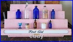 Vintage First Aid Pharmacy Display Unit with Antique Medical Bottles