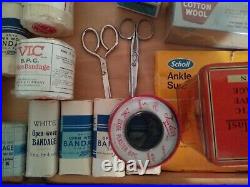 Vintage medical equipment with bandages supplies and tins, collectors boots